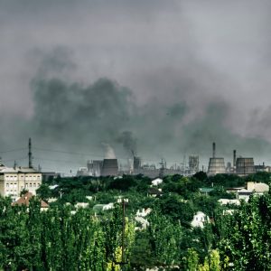 Distance view on smoke smoke rising from the chimneys of metallurgical plant